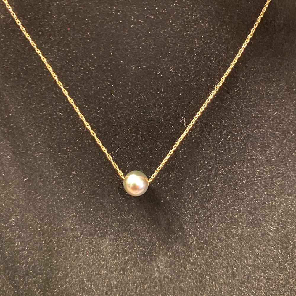 Black Pearl on thin 14 carat 16” chain. Spring clasp.